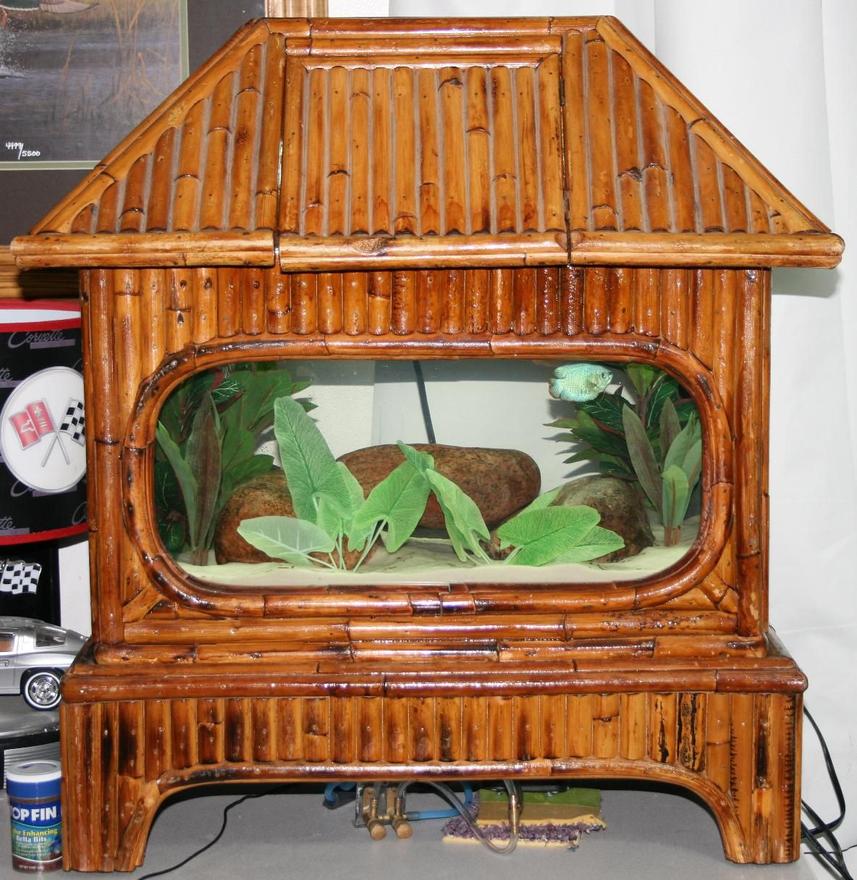 Rated #2306: 5 Gallons Freshwater Fish Tank - Antique Tiki Hut 3 Piece Hood/Tank/Base Made Of Bamboo. Set up with two 25Watt Florescent bulbs. Whisper preset heater for up to 15 gallon tank.