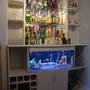 46 gallons freshwater fish tank (mostly fish and non-living decorations) - Fish tank built into bar - filters etc hidden in cupboard underneath